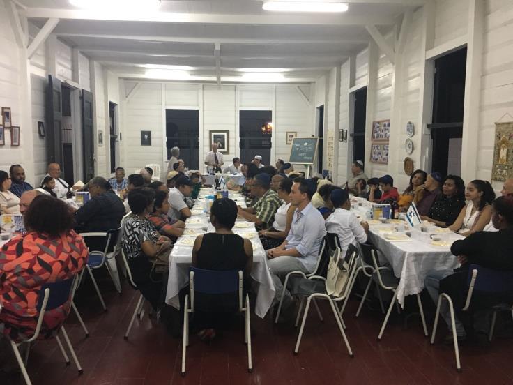 Our community Board of Directors conducting the Seder Because of the economic crisis in Suriname and the Government restriction on foreign currency purchases, we have no access to US dollars.