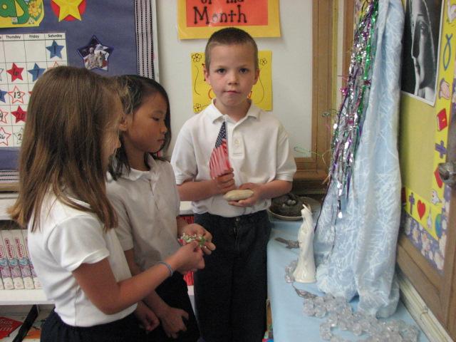 The children of Grade 2 crown Mary each morning and say some Hail Mary s.
