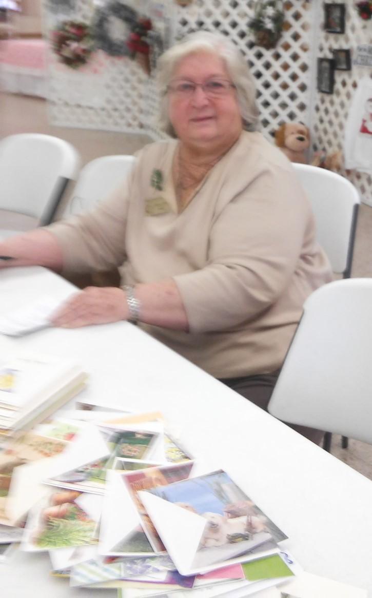 We Know Her as the Card Lady Sherryl Rohlf settles into a chair in Fellowship Hall following a December church service and spreads an assortment of donated cards across the table.