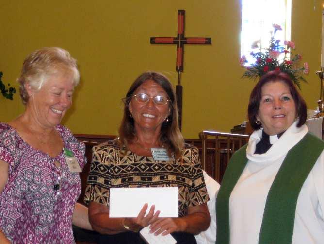 Pictured Right: A check for $900 was received by Bonnie Littrell, President of F.I.S.H., Inc.