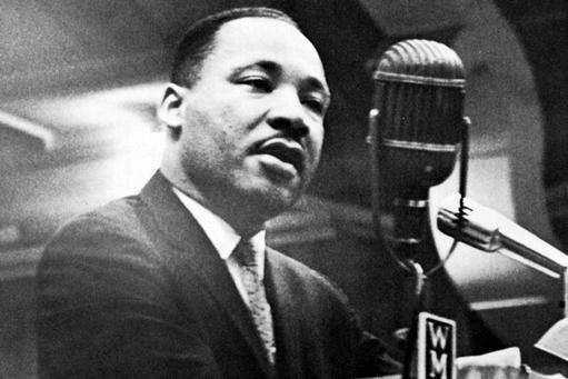 Martin Luther King Jr. talks at a WMUK microphone during his Dec. 18, 1963 visit to Western Michigan University's Read Fieldhouse. CREDIT WESTERN MICHIGAN UNIVERSITY and WMUK.ORG Dr.