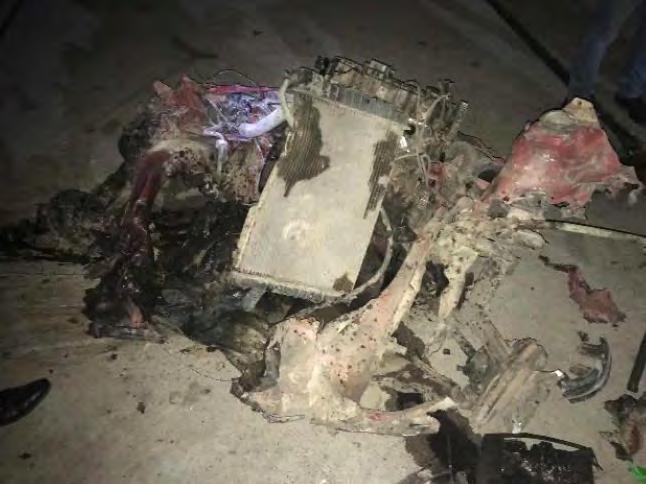 13 Right: Wreckage of the car bomb detonated in Kirkuk.