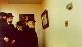 Standing next to one painting, the Rebbe asked Boruch Nachshon why there are no cards explaining what each painting depicts.