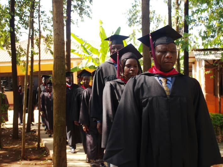 Graduation Day Faculty Line Three graduating classes were led by the faculty members of UBS into the worship area of Acacia Community Church just outside of Jinja.