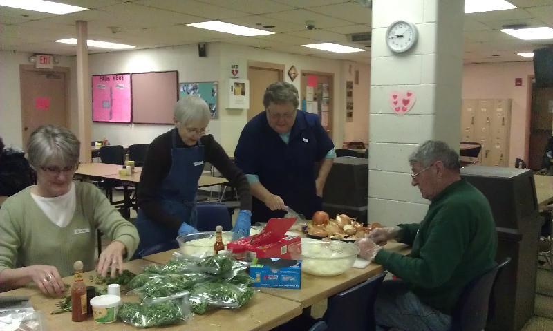 Page 10 of 12 Working to help the community by serving meals at Hesed House in Aurora.