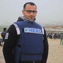 7 Musa Alian's Facebook profile picture shows him wearing a Press vest.
