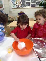 powder into a bowl. They broke the eggs and checked for red spots.