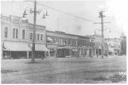 176 HISTORY OF JUAB COUNTY Businesses on west Main Street, between Center and First South, Nephi. (Fred Chapman) posed of people of similar socioeconomic status and were closed to others.