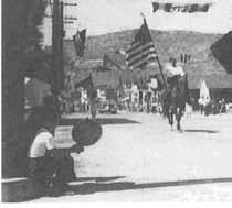 JUAB COUNTY IN THE WORLD WAR II ERA 237 Parade in Eureka passes by the Miner's Union Hall, 1947.