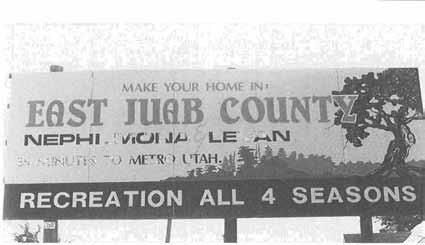 CONTEMPORARY JUAB COUNTY 255, IMEFH-II, MOIMA LEVAN 35 MINUTES TO MFTRO UTAH. RECREATION ALL 4 SE >N Billboard making a pitch for East Juab County; located just outside of Levan, 1997.