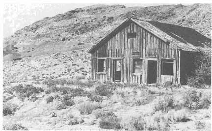 280 HISTORY OF IUAB COUNTY ^t^-y.'-' - Old boarding house at Utah Mines, Fish Springs Mining District, 1997.