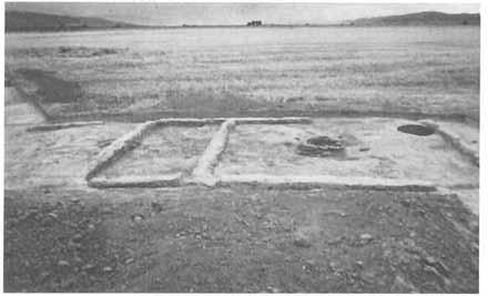 THE ORIGINAL PEOPLES OF JUAB COUNTY 21 Nephi Mounds adobe-walled dwelling with small attached storage structure to the left. A clay-rimmed fire hearth, in the center, remains a prominent feature.