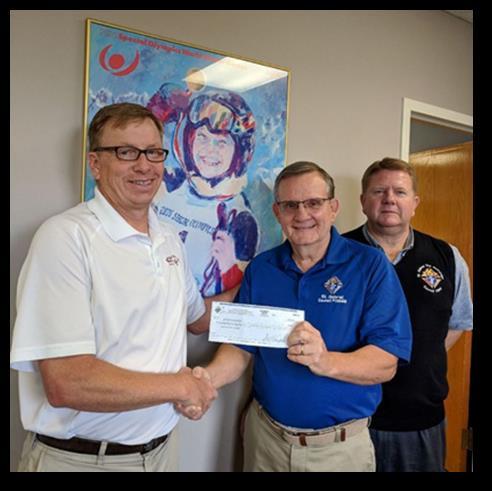 Special Olympics Mark Buerger St. Gabriel Council #15699 presents Donation Jerry Ebell (center) and Phil Miller (right) of St.