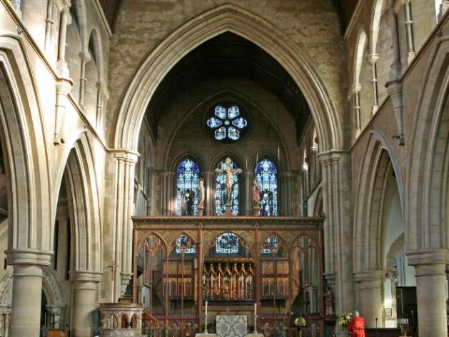 6 THE CHANCEL There is no doubt that the most eye-catching aspect of the church is the beautiful chancel with its carved oak choir stalls, given in 1901, and the great east window with its lovely