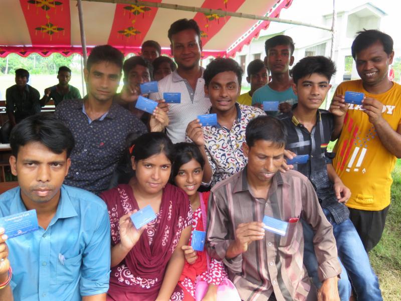 Young adults displaying their Commitment cards: Trino Jara and District Advisory Board Training: Bangladesh