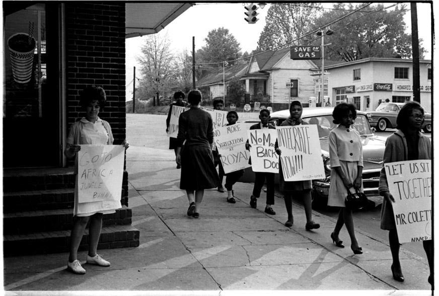 Protest at the Royal Ice Cream Parlor in Durham, NC in 1962. (Courtesy Herald-Sun) Righteousness and peace exchanging a kiss is more than poetic, it is profound.