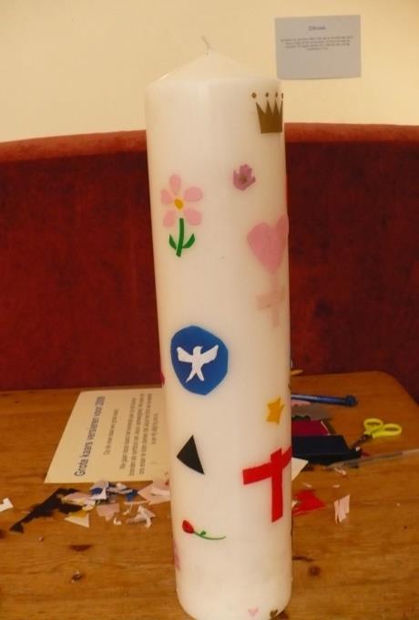 What do you need: - a large white candle - coloured sheets of candle wax - pairs of scissors What do you do: Show the children the candle and ask them what Easter means to them.