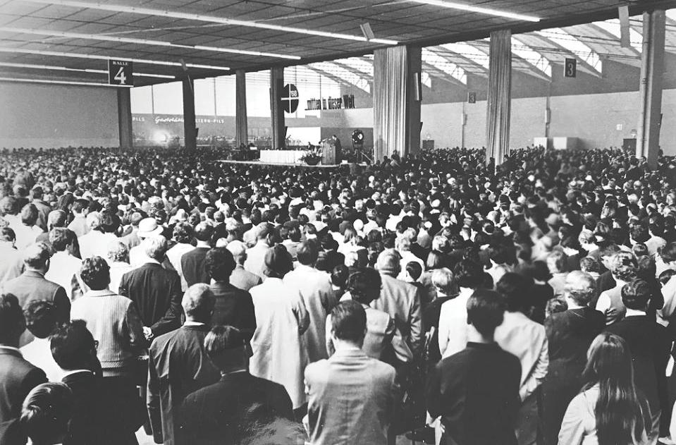 A critic of Pope Paul s encyclical banning contraception draws an overflow crowd of 9,000 at a meeting held during the annual Catholic Day Congress at Essen, West Germany, in 1968.