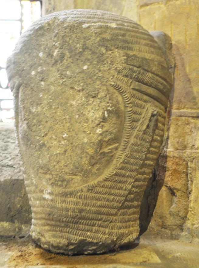 This C13 Stone head of knight wearing chain-mail was discovered in the churchyard in the 1940s and is now to be found on a cill in the southwest corner near the font.