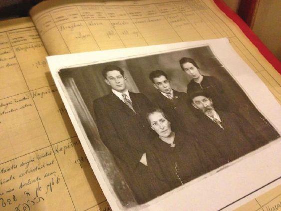 A Second Generation Shoah Memory By Elaine Sneierson Leeder A photo of Samuel Sneierson and his family in Lithuania sits on top of the family s log.