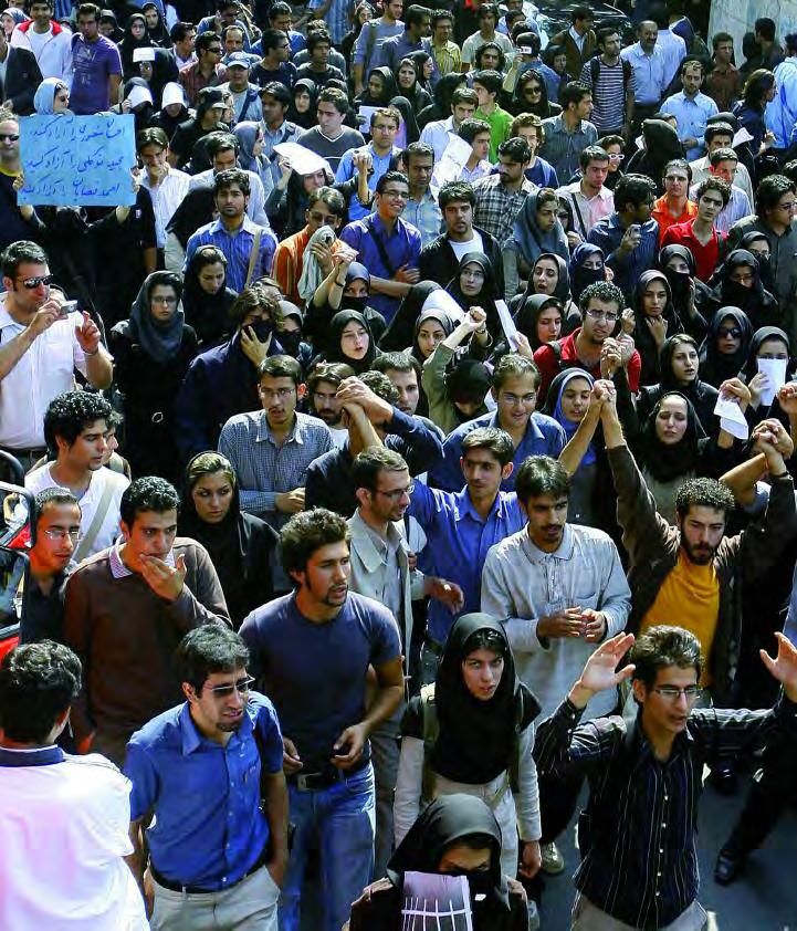 COUNTRIES IN CRISIS THE CRISIS AT HOME Students marching at Tehran University protest an