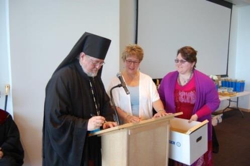 at the Seminary Bishop David officially accepting the archives with Daria