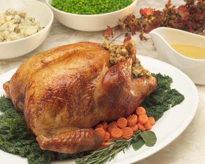 A traditional menu will include roast turkey, dressing, gravy, baked ham, hash brown casserole, cranberry salad, green beans and pumpkin pie.