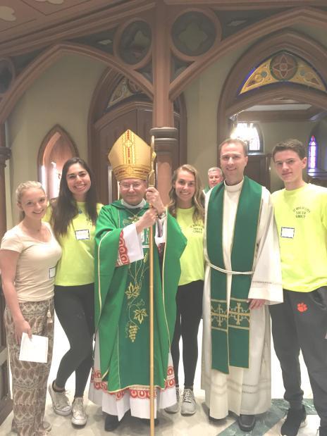 Briana Barillari, Kyle Cunningham, Sarah Lombardo and Stephanie Krueger represent the St. Rose Youth Ministry program at the Diocesan Youth Pilgrimage with Bishop Arthur Serratelli and Fr.
