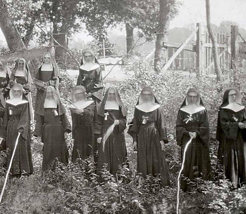 The teaching Sisters at St. Francis Mission, South Dakota, are shown enjoying a picnic outing in this undated glass slide from the early 20th century. The Sisters of St.