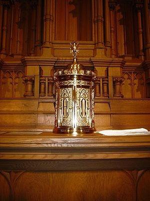 Font A large vessel or pool of holy water used in Baptism.