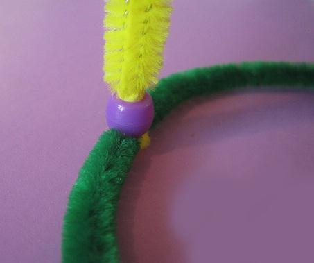 Push all the beads down firmly, then open the pipe cleaner ends to hold them