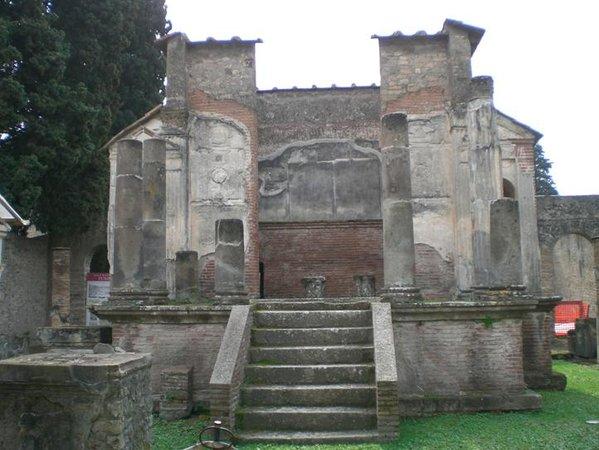 In Pompeii, the Temple of Jupiter overlooks the forum from a raised platform and the central clearing is flanked by the Temple of Apollo on the left and the Temple of Vespasian and the Sanctuary of