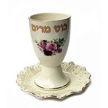 Elegant cream color with gold accents and a floral design. Designed in England. Cup measures 5" high, the coaster is 5 1/2" D.