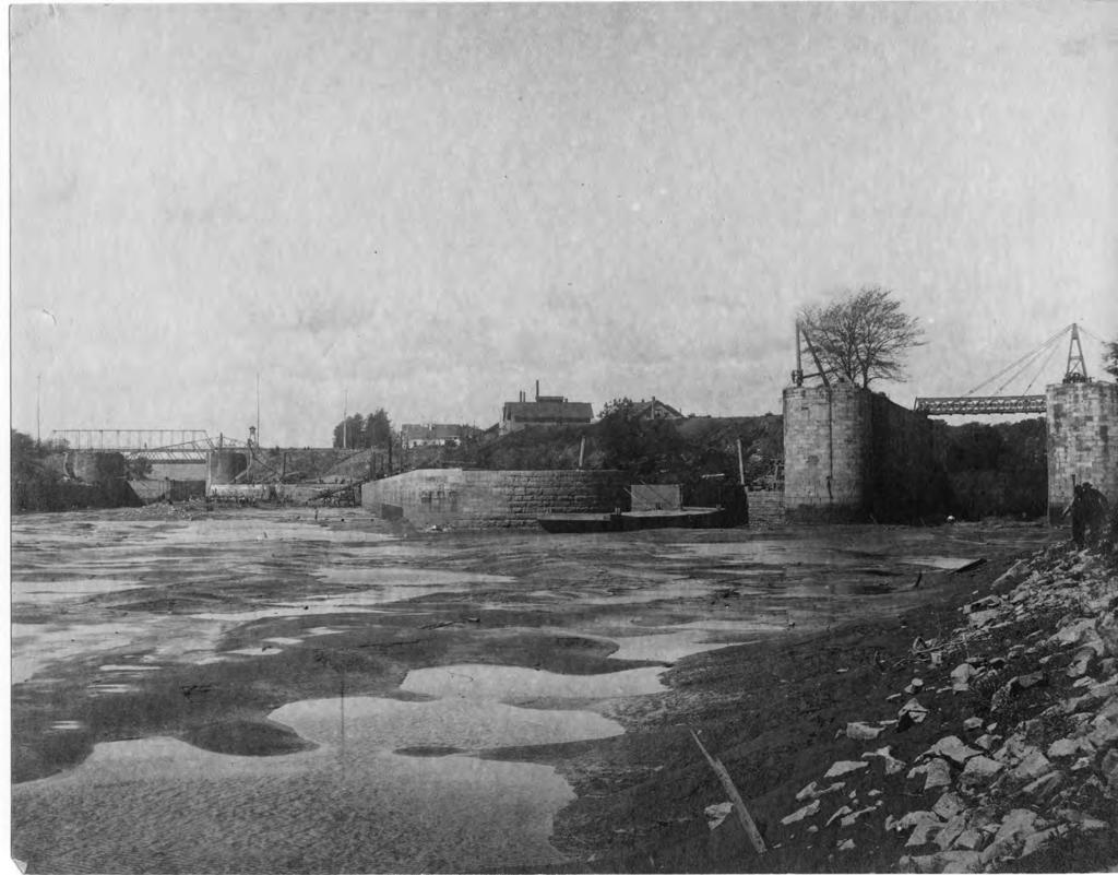 Triumph At The Falls: The Louisville and Portland Canal Canal widening in progress at the entrance to the original locks on the right. To the left is the branch canal and Scowden locks.
