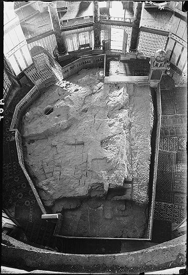 Rock (photo: Library of Congress) Looking down on the rock (Sakhrah) in the center of the Dome of the The Rock is enclosed by two ambulatories (in this case the aisles that circle the rock) and an