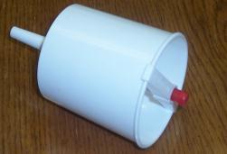 -Filler: Dispenser used to fill communion cups.
