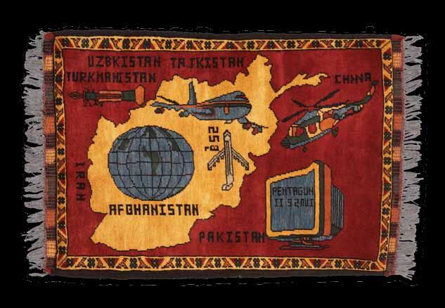 This war rug highlights the global landscape of modern warfare, including references to the Pentagon and the date of September 11th on a computer monitor (T2008.1.110, 86 cm x 58 cm).