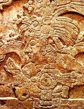 Also his name appears in a hieroglyphic caption, followed by the rabbit-skull variant of the Palenque emblem glyph.