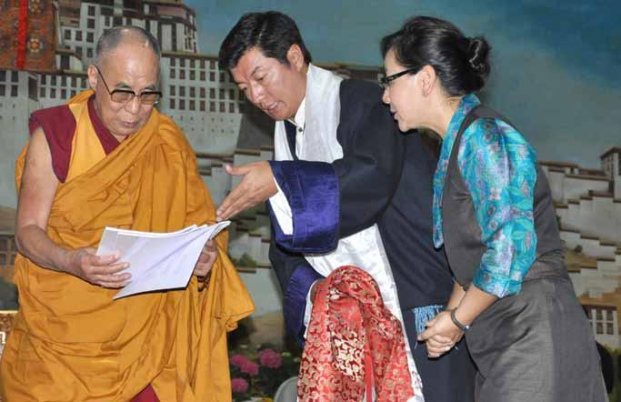 Tibetan political leader Dr Lobsang Sangay presents documents to His Holiness the Dalai Lama on Middle Way policy campaign at