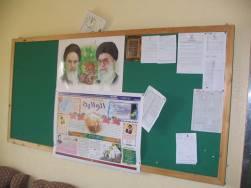 Jbeil (left). Underneath the posters on the right is a large signboard with the text Al- Wilaya (i.e., the rule of the jurisprudent, which is a central component in Khomeini s teachings) A booklet