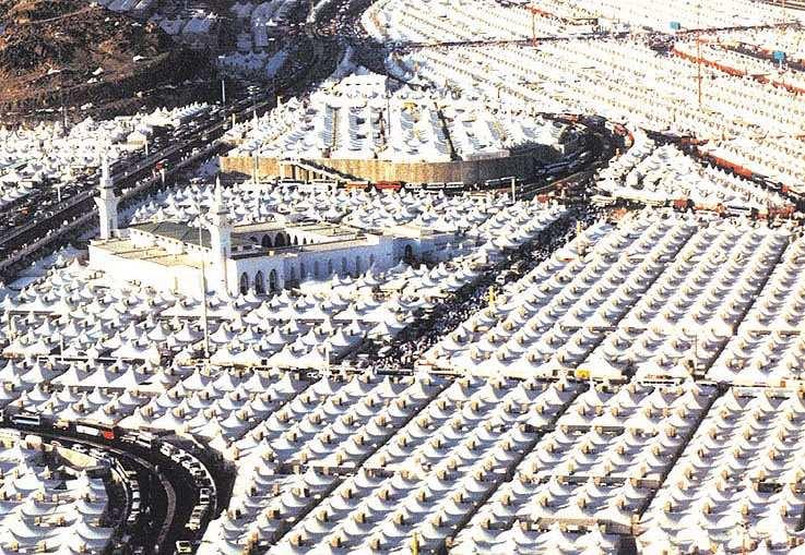 13 Mina Mina, which lies between the Holy City of Makkah and Muzdalifah and is situated some 5 kilometers to the east of the Islamic holy city of Makkah in Saudi Arabia. It is now known as tent city.