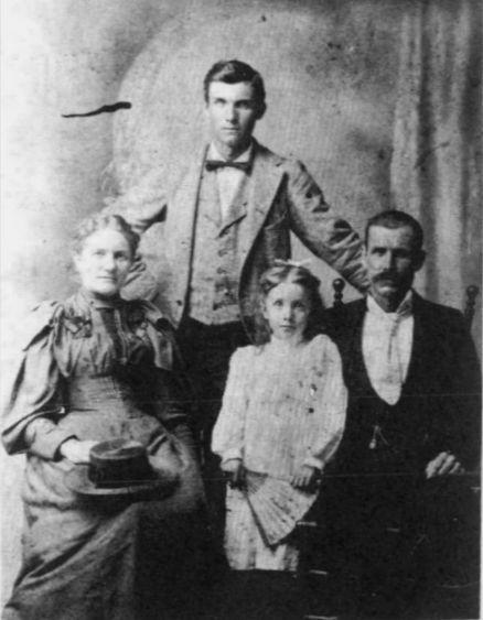 Martha Jane (Jared); daughter, Bessie Lee; husband, William Alexander & standing, her son, Oscar King Holladay.