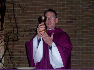 Eucharistic Prayer The priest mixes a little water with the wine to show the human and the divine natures of Christ joined in the Mystery of the Incarnation - God becoming human as the Priest