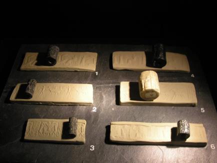 Figure 12: Beautiful pictures of clay that has been rolled with a cylinder seal. Notice how a raised picture was left behind. Often cities would fight wars over land, property, and OWH C2 P10 4.