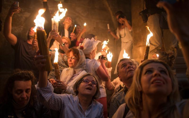 Christians Concerned by Easter Restrictions Catholic News Service, Monday,21 Mar 2016 Faithful hold candles in Jerusalem's Church of the Holy Sepulcher in 2014 (CNS) Restricted access to Easter