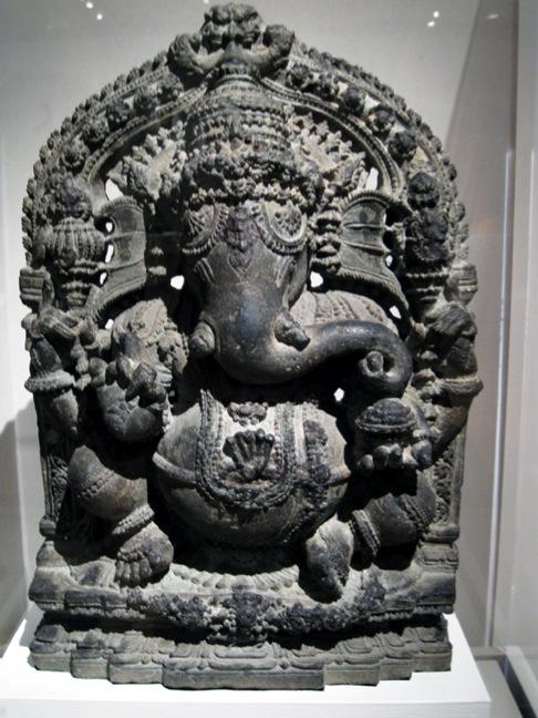 Ganesha the elephant-deity riding a mouse.