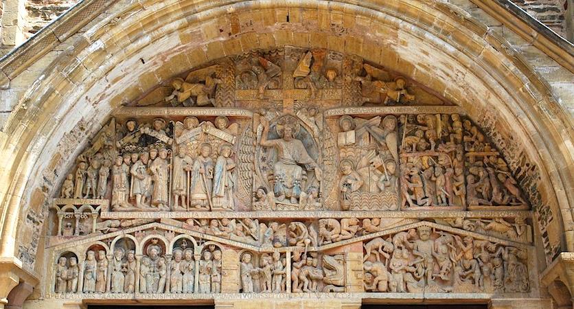 This scene is depicted on the tympanum, the central semi-circular relief carving above the central portal. In the center sits Christ as Judge, and he means business!