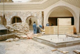 By the time the new font arrived, the roof had been put into place. In order to get the font into the temple, windows in the chapel area had to be widened.