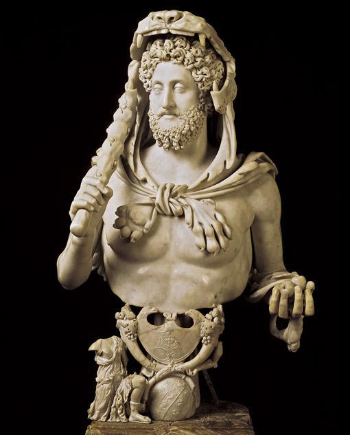 Title: Commodus as Hercules He claimed a relationship to Hercules and ordered many statues representing him as this Greek hero--here with the lion's skin over his head, the club in his right hand,