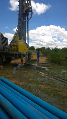 More pictures from the water well in Zimbabwe. Michael stands next to the drill. Now the water can take care of animals, gardens, and people. Someday they will have running water in their homes.
